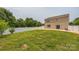 Large, fenced backyard with lush green grass and a cozy patio at 1709 White Willow Ave, Gastonia, NC 28054
