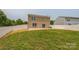 Large backyard with lush green grass and a white wooden fence at 1709 White Willow Ave, Gastonia, NC 28054