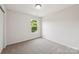 Neutral bedroom with carpet, window view, and natural light at 1709 White Willow Ave, Gastonia, NC 28054