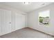 Carpeted bedroom with a closet, window, and neutral walls at 1709 White Willow Ave, Gastonia, NC 28054