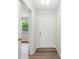 Hallway with hardwood flooring, leading to a bright room with a large window at 1709 White Willow Ave, Gastonia, NC 28054