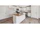 Modern kitchen with stainless steel appliances, granite countertops, white cabinets, and vinyl flooring at 1709 White Willow Ave, Gastonia, NC 28054