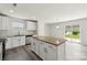 Modern kitchen with granite countertops, white cabinetry, stainless steel appliances and vinyl floors at 1709 White Willow Ave, Gastonia, NC 28054