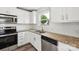 Well-lit kitchen featuring stainless steel appliances, granite counters and white subway tile backsplash at 1709 White Willow Ave, Gastonia, NC 28054