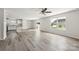 Bright living room with laminate floors, recessed lighting, and large windows offering ample natural light at 1709 White Willow Ave, Gastonia, NC 28054
