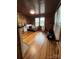 Bedroom with wood flooring and paneling, illuminated by natural light at 200 Prospect Church Rd, Albemarle, NC 28001