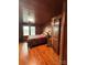 Bedroom with wood flooring, wood paneling, natural light and closet at 200 Prospect Church Rd, Albemarle, NC 28001