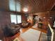 Cozy living room with wood paneling, fireplace, and hardwood floors at 200 Prospect Church Rd, Albemarle, NC 28001