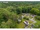 Aerial view of a neighborhood with homes surrounded by green trees with sidewalks and driveways at 216 Hillcrest Pl, Salisbury, NC 28144
