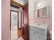 View of a bathroom featuring a vanity with a large mirror, and an open doorway to another room at 216 Hillcrest Pl, Salisbury, NC 28144