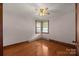 Bedroom featuring hardwood floors and a large window providing plenty of natural light at 216 Hillcrest Pl, Salisbury, NC 28144