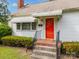 Exterior shot showcasing the front of the house with a red front door and decorative awnings at 216 Hillcrest Pl, Salisbury, NC 28144