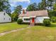 A charming home with a red door, green lawn, and separate garage at 216 Hillcrest Pl, Salisbury, NC 28144