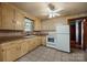 Bright kitchen featuring a spacious tile floor, ceiling fan and updated appliances at 216 Hillcrest Pl, Salisbury, NC 28144
