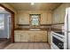 A kitchen view featuring tile flooring, updated appliances, and good lighting at 216 Hillcrest Pl, Salisbury, NC 28144
