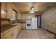 Functional kitchen with tile floor, ceiling fan, and ample cabinet space at 216 Hillcrest Pl, Salisbury, NC 28144