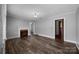 An empty living room features hardwood floors and a fireplace at 216 Hillcrest Pl, Salisbury, NC 28144