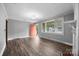 Inviting living room featuring hardwood floors and a large window offering plenty of natural light at 216 Hillcrest Pl, Salisbury, NC 28144