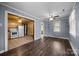 Open-concept room with hardwood floors connected to the kitchen with updated appliances at 216 Hillcrest Pl, Salisbury, NC 28144