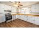 Traditional kitchen with white cabinets, wood countertops, and stainless steel appliances at 260 Penninger Dr, Woodleaf, NC 27054