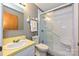 Full bathroom with a mirror, sink, toilet, shower, and yellow countertops at 267 Buffalo Nw Ave, Concord, NC 28025