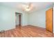 Bright bedroom features a ceiling fan and hardwood floors, with a closet and access to an adjoined room at 267 Buffalo Nw Ave, Concord, NC 28025