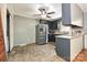 A well-lit kitchen features stainless steel refrigerator and ample counter space at 267 Buffalo Nw Ave, Concord, NC 28025