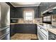 Well-designed kitchen featuring ample countertop space and modern appliances with an adjacent window at 267 Buffalo Nw Ave, Concord, NC 28025