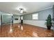 Bright and spacious living room featuring durable floors and smooth transitions to kitchen area at 267 Buffalo Nw Ave, Concord, NC 28025