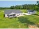 Aerial view of the property featuring a well-maintained home and detached garage at 2737 Bobcat Rd, Heath Springs, SC 29058