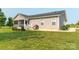Well-maintained backyard featuring a charming screened-in porch and lush green lawn at 2737 Bobcat Rd, Heath Springs, SC 29058