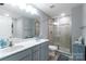 This bathroom features a double sink vanity and glass enclosed shower at 2737 Bobcat Rd, Heath Springs, SC 29058