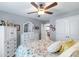 This bedroom features a ceiling fan, dresser with mirror and double closet at 2737 Bobcat Rd, Heath Springs, SC 29058