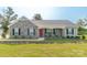 Charming single-story home featuring stone accents, a welcoming front porch, and a well-maintained front yard at 2737 Bobcat Rd, Heath Springs, SC 29058