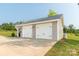 Spacious detached two-car garage with modern doors and ample parking space at 2737 Bobcat Rd, Heath Springs, SC 29058