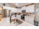 Bright kitchen featuring white cabinets, granite countertops, stainless steel appliances, and light wood flooring at 2737 Bobcat Rd, Heath Springs, SC 29058