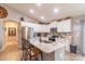 Bright kitchen featuring white cabinets, granite countertops, stainless steel appliances, and light wood flooring at 2737 Bobcat Rd, Heath Springs, SC 29058