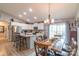 Bright kitchen featuring white cabinets, granite countertops, stainless steel appliances, and an adjacent dining area at 2737 Bobcat Rd, Heath Springs, SC 29058