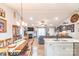 Bright kitchen featuring white cabinets, granite countertops, stainless steel appliances, and light wood flooring at 2737 Bobcat Rd, Heath Springs, SC 29058