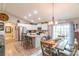 Bright kitchen featuring white cabinets, granite countertops, stainless steel appliances, and light wood flooring at 2737 Bobcat Rd, Heath Springs, SC 29058