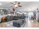 Open concept living space with a modern gray couch and adjoined kitchen with stainless steel appliances at 2737 Bobcat Rd, Heath Springs, SC 29058