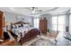 This bedroom features a tray ceiling, ceiling fan, and carpet at 2737 Bobcat Rd, Heath Springs, SC 29058