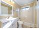 Bathroom with a white vanity, toilet, and bath tub at 2809 Markland Dr, Charlotte, NC 28208