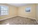 A bright bedroom featuring fresh paint, plush carpeting, and natural light, creating a cozy atmosphere at 2809 Markland Dr, Charlotte, NC 28208