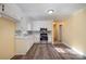 Bright kitchen features white cabinets, modern appliances, and sleek wood floors, blending style and functionality at 2809 Markland Dr, Charlotte, NC 28208