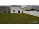 Spacious backyard featuring lush green grass and a privacy fence, ideal for outdoor activities at 3014 Green Apple Dr, Dallas, NC 28034