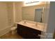 Well-lit bathroom features a double vanity, dark cabinets and a shower/tub combo at 3014 Green Apple Dr, Dallas, NC 28034