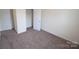 Carpeted bedroom offers closet space and neutral colors for a blank canvas at 3014 Green Apple Dr, Dallas, NC 28034