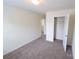 Bright, carpeted bedroom featuring neutral walls, closet, and easy access to other rooms at 3014 Green Apple Dr, Dallas, NC 28034
