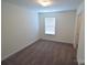 Neutral bedroom boasts carpet floors, white walls, a window and a closet at 3014 Green Apple Dr, Dallas, NC 28034